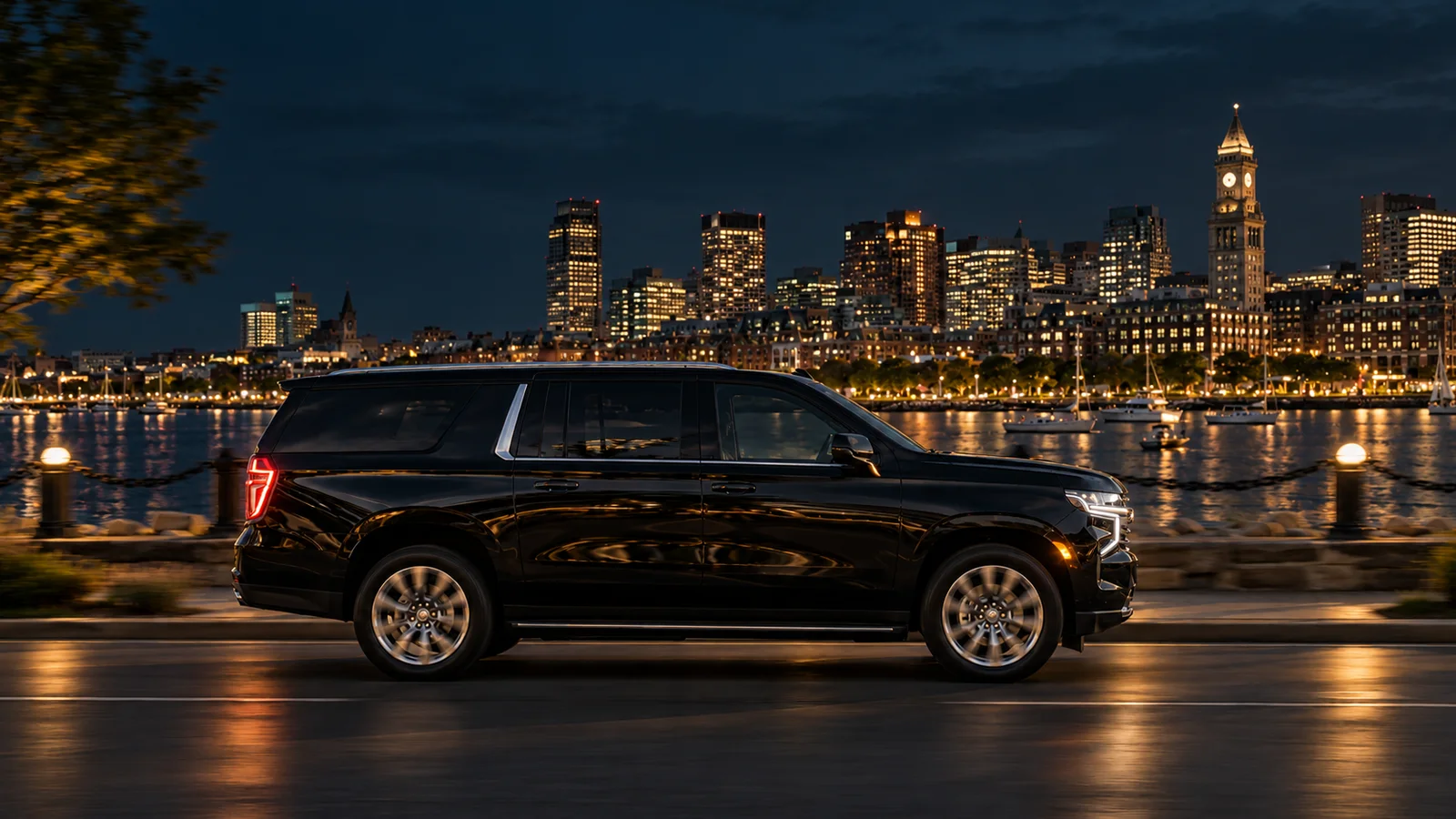 Black Chevrolet Suburban with Boston city lights